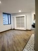 Modern home with Living Room, Ceiling Lighting, Light Hardwood Floor, and Gas Burning Fireplace. Fireplace gas Photo 3 of Bogota downtown