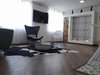 Modern home with Living Room, Light Hardwood Floor, Chair, Ceiling Lighting, and Gas Burning Fireplace. Living room Photo 10 of Bogota downtown