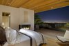 Modern home with Bedroom, Bed, Chair, Recessed Lighting, and Light Hardwood Floor. The master bedroom opens up to the deck and facilitates unending views of the San Francisco Bay. Photo 4 of Tiburon Home