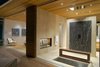 Modern home with Bath Room, Drop In Tub, and Recessed Lighting. The master bathroom includes a rain shower, sunken tub, and a fireplace as well as opening glass NanaWall systems. Photo 10 of Tiburon Home