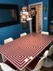 Modern home with Dining Room. Custom dining table I built for around $150, two by fours, OSB, and painted subsurface glass inspired by the Op art movement. Photo 2 of The Roaches world