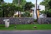 Modern home with Exterior, House Building Type, Beach House Building Type, Shingles Roof Material, Metal Siding Material, Wood Siding Material, and Flat RoofLine. Front entrance to property Photo 10 of A Modern 1954 Plantation Style Home on Maui
