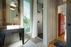 Modern home with Wood Counter, Porcelain Tile Floor, and Pendant Lighting. Ohana Bathroom Photo 14 of A Modern 1954 Plantation Style Home on Maui