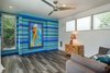 Modern home with Bedroom, Bed, Recessed Lighting, and Porcelain Tile Floor. Guest Bedroom in main house with murphy bed and hidden cabinets Photo 18 of A Modern 1954 Plantation Style Home on Maui