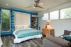 Modern home with Bedroom, Bed, Porcelain Tile Floor, and Recessed Lighting. Guest Bedroom in main house with murphy bed pulled down and hidden cabinets open Photo 19 of A Modern 1954 Plantation Style Home on Maui