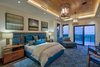 Modern home with Bedroom, Dark Hardwood Floor, Bed, Ceiling Lighting, Accent Lighting, Pendant Lighting, Recessed Lighting, and Night Stands. Master Suite Photo 2 of Maui Beachfront Villa