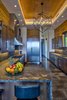 Modern home with Kitchen, Ice Maker, Refrigerator, Wine Cooler, Microwave, Range, Dishwasher, Pendant Lighting, Undermount Sink, Stone Slab Backsplashe, Recessed Lighting, Quartzite Counter, Wood Cabinet, Beverage Center, Limestone Floor, Accent Lighting, and Range Hood. Kitchen Photo 11 of Maui Beachfront Villa