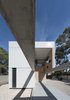 Modern home with Outdoor, Back Yard, Concrete Patio, Porch, Deck, Large Patio, Porch, Deck, Trees, and Post Lighting. concrete beams, walls and paving serve as containing envelopes and a threshold for handmade brick structures which house the rooms on the lower floor Photo 4 of iA_house