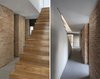 Modern home with Staircase, Wood Tread, and Wood Railing. exposed handmade brick compliments the sleek shine of wood used for the house’s staircase Photo 5 of iA_house