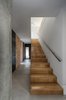 Modern home with Staircase, Wood Tread, and Wood Railing. wood + manual lime brickwork + concrete Photo 10 of iA_house