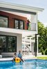 Modern home with Outdoor, Back Yard, Hardscapes, Large Pools, Tubs, Shower, Salt Water Pools, Tubs, Shower, Concrete Pools, Tubs, Shower, Swimming Pools, Tubs, Shower, Large Patio, Porch, Deck, Concrete Patio, Porch, Deck, and Pavers Patio, Porch, Deck. Taking a break in the pool, and for the Summer at least, not missing Santa Monica! Photo 4 of Roslyn Road Residence
