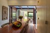 Modern home with Dining Room, Table, Storage, and Medium Hardwood Floor. Shifting volumes of living spaces linked by restored industrial work bench. Photo 9 of Kihilla