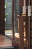 Custom pivot door; composition of river red gum, kangaroo leather, stainless steel, and glass. Photo 12 of Kihilla modern home