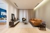 Modern home with Living Room, Sofa, Coffee Tables, Lamps, Media Cabinet, Chair, Ceiling Lighting, and Light Hardwood Floor. Livingroom Photo 5 of A.P01