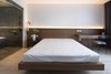 Modern home with Bedroom, Bed, Light Hardwood Floor, Ceiling Lighting, Night Stands, and Chair. Master bedroom Photo 6 of A.D02