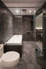 Modern home with Bath Room, Tile Counter, One Piece Toilet, Drop In Tub, Ceramic Tile Wall, Ceiling Lighting, and Ceramic Tile Floor. Master bathroom Photo 8 of A.D02