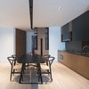 Modern home with Kitchen, Light Hardwood Floor, Drop In Sink, Ceiling Lighting, Range Hood, Stone Slab Backsplashe, Microwave, Refrigerator, Wood Cabinet, Quartzite Counter, and Range. Kitchen & Dining table Photo 17 of A.D02