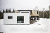 Modern home with Exterior, House Building Type, Prefab Building Type, Wood Siding Material, and Flat RoofLine. Aluminium tiles on the exteriors walls, aluminium inserts into the wood clading. Photo 4 of Maison Lac Brûlé