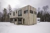 Modern home with Exterior, House Building Type, Wood Siding Material, Metal Siding Material, Flat RoofLine, and Cabin Building Type. Main entrance façade Photo 7 of Maison Lac Brûlé
