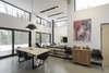 Modern home with Living Room, Ceiling Lighting, Table Lighting, Track Lighting, Accent Lighting, Concrete Floor, Hanging Fireplace, and Wood Burning Fireplace. Interiors Photo 10 of Maison Lac Brûlé