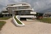 Modern home with Exterior, Apartment Building Type, Wood Siding Material, Concrete Siding Material, Stone Siding Material, Stucco Siding Material, Glass Siding Material, and Green Roof Material. villa C _ entrance north facade Photo of De Haaf Bergen, The Netherlands
