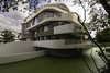 Modern home with Exterior, Apartment Building Type, Green Roof Material, Wood Siding Material, Concrete Siding Material, Stucco Siding Material, Stone Siding Material, Glass Siding Material, and Flat RoofLine. villa B _ west facade Photo 2 of De Haaf Bergen, The Netherlands