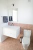 Modern home with Bath Room, Engineered Quartz Counter, Cement Tile Floor, Porcelain Tile Floor, Ceramic Tile Floor, Wall Lighting, Ceramic Tile Wall, Concrete Wall, Porcelain Tile Wall, and Undermount Sink. Erin Adams tile adds interest and color to a minimal bathroom Photo 5 of Division Street ADU