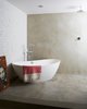 Modern home with Bath Room, Concrete Counter, Freestanding Tub, Open Shower, Concrete Wall, and Full Shower. Hand-troweled concrete bathroom Photo 7 of Williamsburg Rowhouse