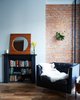 Modern home with Hallway and Medium Hardwood Floor. In compact Brooklyn brownstones, every square foot must be treasured and used. We re-purposed an old fireplace into a bookshelf. Photo 5 of Williamsburg Rowhouse