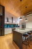 Modern home with Kitchen, Refrigerator, Range, Microwave, White Cabinet, Medium Hardwood Floor, Pendant Lighting, Recessed Lighting, and Accent Lighting. Eat-in Kitchen. Ikea cabinets. Concrete counters. Photo 5 of Mike's Hammock
