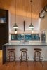 Modern home with Kitchen, Refrigerator, Concrete Counter, Range, Medium Hardwood Floor, Pendant Lighting, Recessed Lighting, Accent Lighting, and White Cabinet. Eat-in Kitchen Photo 4 of Mike's Hammock