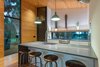 Modern home with Kitchen, Refrigerator, Range, Microwave, White Cabinet, Medium Hardwood Floor, Recessed Lighting, Accent Lighting, Concrete Counter, and Pendant Lighting. Eat-in Kitchen. Concrete tops. IKEA cabinets. Integrated sink. Photo 6 of Mike's Hammock