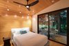 Modern home with Bedroom, Bed, Track Lighting, Medium Hardwood Floor, and Recessed Lighting. Bedroom Photo 9 of Mike's Hammock
