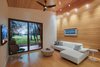 Modern home with Living Room, Chair, Coffee Tables, Track Lighting, Recessed Lighting, Medium Hardwood Floor, Sectional, and End Tables. Living Space Photo 12 of Mike's Hammock
