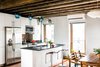Modern home with Kitchen, Granite Counter, White Cabinet, and Pendant Lighting. Kitchen Photo 8 of Brooklyn Upside Down with Views