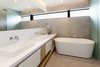 Modern home with Bath Room, Freestanding Tub, Vessel Sink, Ceramic Tile Floor, Engineered Quartz Counter, Ceramic Tile Wall, and Enclosed Shower. Master bathroom Photo 14 of Kelly House