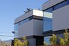 Modern home with Exterior, House, Stucco Siding Material, Glass Siding Material, Metal Siding Material, and Flat RoofLine. West facade Photo 7 of Kelly House