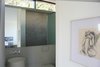 Modern home with Bath Room, Pedestal Sink, Enclosed Shower, Ceiling Lighting, Recessed Lighting, and One Piece Toilet. Powder room Photo 11 of Kelly House