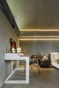 Modern home with Bedroom, Chair, Wall Lighting, Bed, Bench, and Concrete Floor. SOA Soler Orozco Arquitectos . Casa Molina Photo 14 of Casa Molina