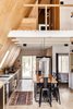 Modern home with Dining Room, Table, Desk, Pendant Lighting, Storage, Light Hardwood Floor, and Stools. Kitchen and loft with live edge dining table/kitchen island by Timberforge Woodworks Photo of Lokal A-Frame