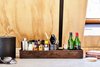 Modern home with Kitchen and Concrete Counter. Bar supplies by Art in the Age. Detail of original beam reveal shown painted with matte black milk paint. Photo 14 of Lokal A-Frame