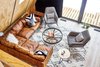 Modern home with Living Room, Storage, End Tables, Floor Lighting, Coffee Tables, Light Hardwood Floor, Sectional, and Chair. Living room from loft with the fought over Nirvana sectional by Article. Photo 2 of Lokal A-Frame