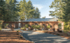 Modern home with Exterior, House Building Type, Metal Roof Material, and Wood Siding Material. You arrive at the Barn Gallery via a meandering driveway through native woodland of Fir, Pine and Alder.
Five species of Bamboo and several different ornamental grasses integrated with wildflowers will become more evident as the natural landscaping matures.
The Bamboo nearest to the house is in spiral galvanized pots fabricated from the left over culvert used for the pre-filtration tower located near the rain storage tank. Photo 19 of The Barn Gallery