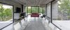 Modern home with Living Room, Bench, Chair, Sofa, Accent Lighting, Wood Burning Fireplace, and Concrete Floor. Wein House - Besonías Almeida arquitectos Photo 7 of Wein House