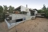 Modern home with Exterior, Beach House Building Type, Concrete Siding Material, and Glass Siding Material. Wein House - Besonías Almeida arquitectos Photo 5 of Wein House