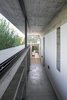 Modern home with Hallway and Concrete Floor. Wein House - Besonías Almeida arquitectos Photo 11 of Wein House