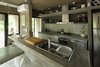 Modern home with Kitchen, Concrete Counter, Laminate Cabinet, Accent Lighting, Undermount Sink, and Mosaic Tile Backsplashe. S&S House - Besonías Almeida arquitectos Photo 12 of S&S House