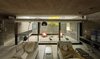 Modern home with Living Room, Sofa, Bench, Coffee Tables, Floor Lighting, Accent Lighting, and Ceramic Tile Floor. S&S House - Besonías Almeida arquitectos Photo 9 of S&S House