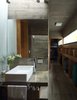 Modern home with Bath Room, Concrete Counter, Ceramic Tile Floor, Drop In Sink, Accent Lighting, and Concrete Wall. S&S House - Besonías Almeida arquitectos Photo 15 of S&S House