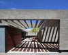 Modern home with Exterior, House, Beach House Building Type, Wood Siding Material, Concrete Siding Material, Metal Siding Material, and Glass Siding Material. S&S House - Besonías Almeida arquitectos Photo 6 of S&S House